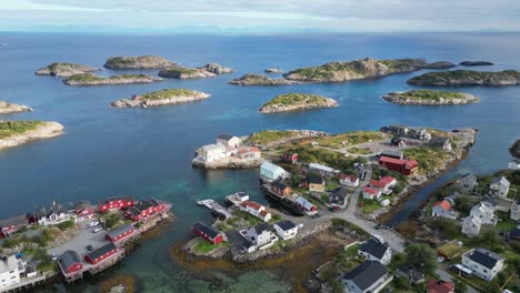 Henningsvaer-Islands-and-Red-Fishermans-Cabins-at-Lofoten-Island,-Norway,-Scandinavia---4k-Aerial