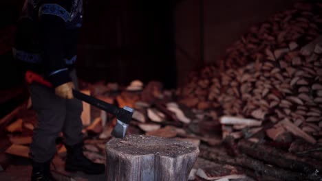 Man-Chopping-Firewoods-With-Axe-In-Indre-Fosen,-Norway