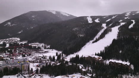 Cinematic-Colorado-aerial-drone-winter-December-Christmas-Summit-Cove-Keystone-Ski-Resort-Epic-Local-Pass-entrance-Rocky-Mountains-i70-Breckenridge-Vail-Summit-County-High-Country-upwards-motion