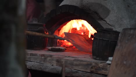 Traditional-Bread-Baking:-Old-Style-Oven,-Wood-Fire,-Curved-Stone,-a-Time-Honored-Culinary-Craft-Unleashing-the-Aroma-of-Homemade-Delight