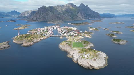 Henningsvaer-Soccer-Field-and-Village-in-Lofoten-Island-Archipelago,-Norway---4k-Aerial-Circling