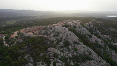 La-Fortezza-di-Monte-Altura,-Sardinia:-Orbital-aerial-view-during-sunset-over-this-beautiful-fortress