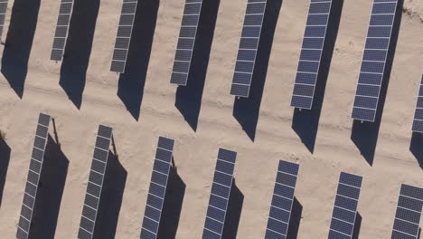 Solar-Panel-Arrays-as-a-Desert-Solar-Farm,-Aerial-Top-Down-Ascending