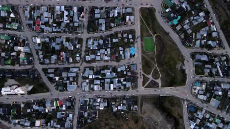 Top-down-drone-shot-flying-along-the-grid-of-Ushuaia,-Argentina