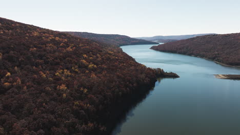 Calm-Waters-Of-Lake-During-Autumn-At-Lake-Fort-Smith-State-Park-In-AR,-USA---Drone-Shot