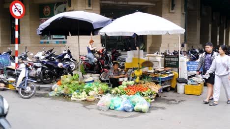 Street-market-seller-takes-lunch-break-from-selling-groceries-to-customers