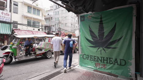 Marijuana-Sign-and-Tuktuk-in-Chinatown-in-Bangkok,-Thailand