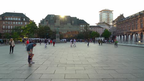 Strasbourg's-Place-Kleber-main-square,-featuring-an-expansive-pedestrian-area-with-shops-and-cafes-along-the-sides
