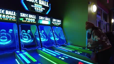 Young-person-playing-skee-ball-in-an-arcade