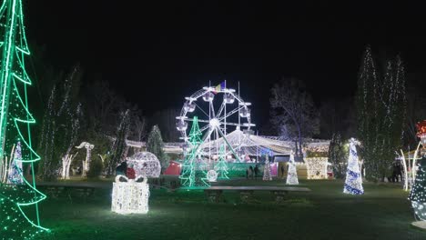 Christmas-Lights-Display-And-Illuminated-Ferris-Wheel-At-Amusement-Park-At-Night-In-Galati,-Romania