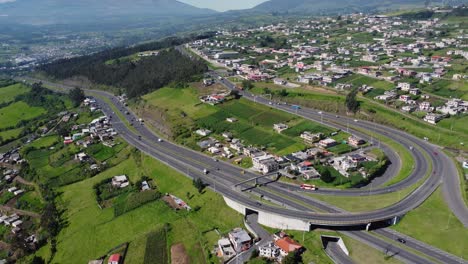 Witness-the-majestic-Santa-Rosa-Curve-from-an-elevated-perspective-with-this-zoom-out-aerial-video-in-Cutuglahua-parish,-Mejía-Canton