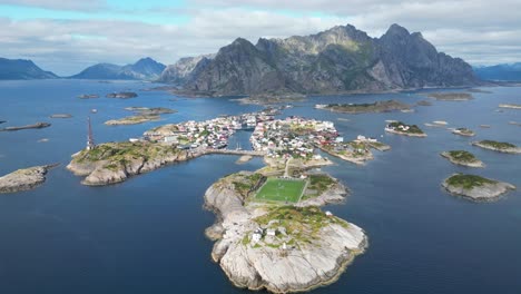 Henningsvaer-Village-and-Soccer-Field-in-Lofoten-Island-Archipelago,-Norway---4k-Aerial