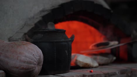 Bread-Aromas:-Baker's-Shovel-Reveals-Freshly-Baked-Breads-from-Wood-Fired-Oven-in-a-Vintage-Stone-Hearth-Setting,-a-Human-Invention-Delight