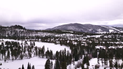 Cinematic-Colorado-aerial-drone-winter-December-Christmas-Summit-Cove-Keystone-Ski-Resort-Epic-Local-Pass-entrance-Rocky-Mountains-i70-Breckenridge-Vail-Summit-County-High-Country-living-down-motion