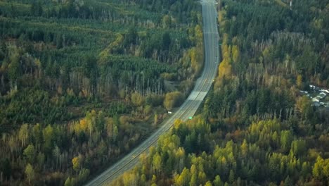 Aerial-View-of-Almost-Empty-Highway-in-Densely-Forested-Landscape
