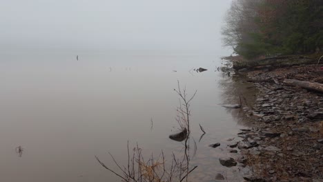 Foggy,-beautiful,-mysterious-early-spring-day-on-a-pristine-mountain-lake
