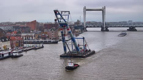 Riverside-charm-of-city-provides-backdrop-as-formidable-crane-and-boat-pass