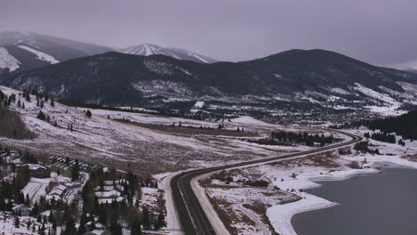 Lake-Dillon-Keystone-Summit-cove-car-highway-Colorado-aerial-cinematic-drone-cloudy-snowy-winter-morning-view-Frisco-Breckenridge-Silverthorne-Ten-Mile-Range-peaceful-calm-frozen-ice-circle-right