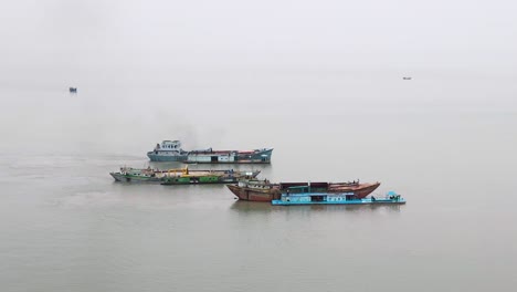 Sand-dredging-cargo-ship-near-coast-of-Bangladesh-in-Bay-of-Bengal,-aerial