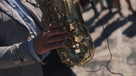 Close-up-of-musician's-hands-playing-saxophone