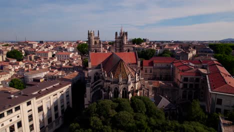 Aerial-orbiting-shot-of-a-beautiful-antique-church-in-downtown-Montpellier