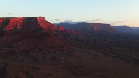 Aerial-cinematic-drone-dramatic-Moab-Utah-orange-red-sunset-mountain-snow-peak-Big-Enchilada-landscape-Arches-National-Park-Castle-Valley-Castleton-Fishers-Tower-camping-Colorado-river-slowly-upward