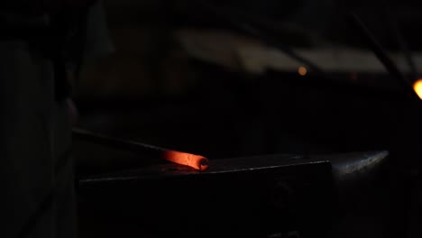 Blacksmith-Forging-Heated-Iron,-Distinguishing-Tools-in-the-Forge-with-Ancient-Techniques-of-Craftsmanship