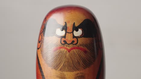 Vintage-hollow,-round,-Japanese-traditional-doll-modeled-after-Bodhidharma