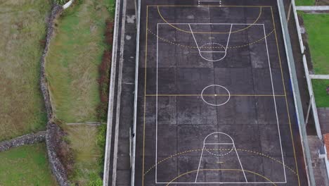 Drone-view-of-soccer-court-at-Fajã-Grande-village-in-Azores,-Portugal