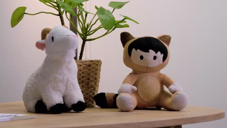 slow-orbiting-shot-of-small-animal-soft-toys-sitting-on-a-coffee-table