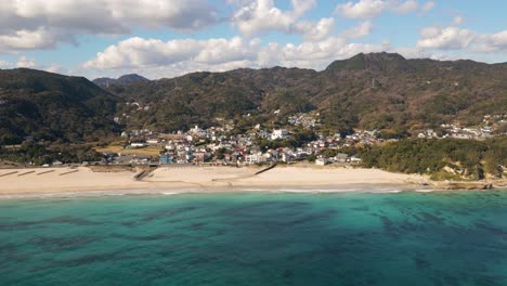 Slow-motion-drone-flight-over-stunning-summer-beach-in-Izu,-Japan