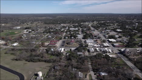 Aerial-Shot-over-Johnson-City,-Texas-and-Hill-Country,-with-historic-courthouse
