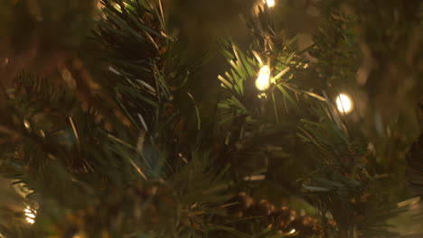 Christmas-tree-ornaments-and-lights-in-a-close-up,-bokeh,-slider-move,-trendy-decorations