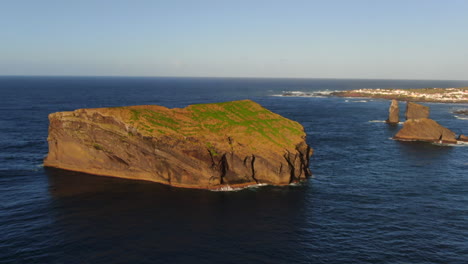 Mosteiros-beach-on-Sao-Miguel-island:-aerial-view-in-orbit-over-large-rock-formation-near-the-beach