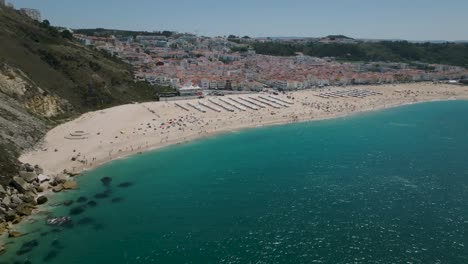 Drone-shot-of-Nazaré-from-the-sea-to-the-beach-and-finished-in-the-city