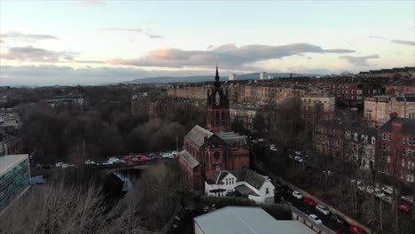 Aerial-view-of-Kelvinbridge-Parish-Church,-Glasgow,-Scotland,-UK-in-cold-autumn-evening