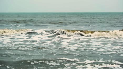 Waves-of-dirty-polluted-ocean-water-of-Indian-ocean,-bay-of-Bengal-in-monsoon-season