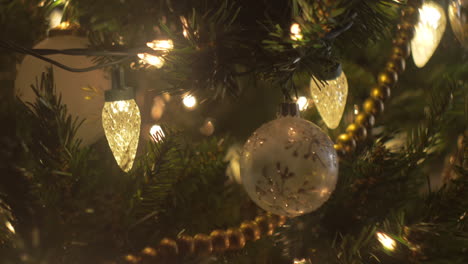 Christmas-tree-ornaments-and-lights-in-a-close-up,-bokeh,-slider-move,-cute-decorations