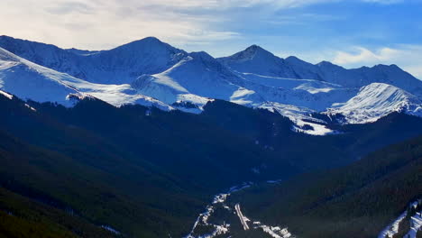 Towards-Leadville-Copper-Mountain-Colorado-Winter-December-Christmas-aerial-drone-cinematic-landscape-i70-Silverthorne-Vail-Aspen-Ten-Mile-Range-blue-sky-clouds-Rocky-Mountains-forward-motion