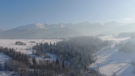 Aerial-view-of-Tatra-Mountain-valley-in-Zakopane,-Poland,-in-winter-snow
