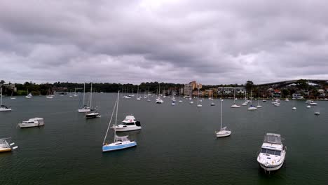 Serenity-on-the-Water:-A-Calm-Marina-Filled-with-Boats-Against-a-Cloudy-Sky-Backdrop