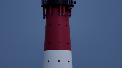 Lighthouse-at-dusk,-landmark-on-the-North-Sea