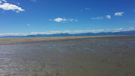 Sunny-day-flyover-mudflats-to-sandbar-veering-to-the-right-on-a-beautiful-sunny-day