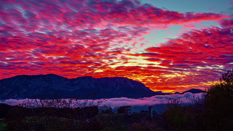 Colorful,-vibrant-sunset-with-fog-in-the-valley---dreamy,-magical-time-lapse