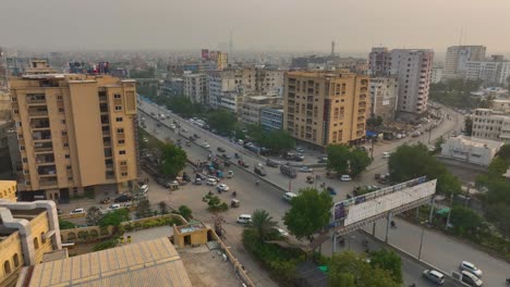 Dusk-Traffic-on-Shaheed-e-Millat-Road,-Karachi---aerial