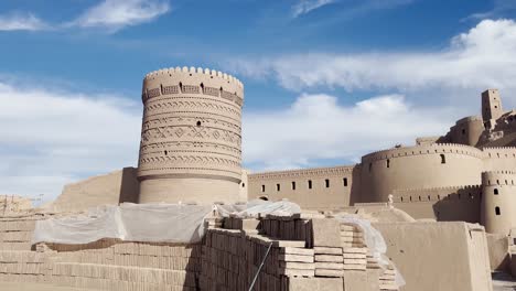 Ornate-Tower-of-Arg-e-Bam,-Iran-Under-Blue-Skies