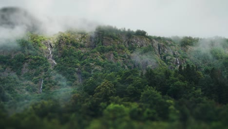 Fog-hangs-above-the-forest-covered-cliffs-and-waterfalls
