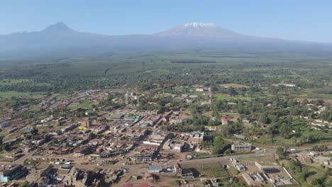 Urban-landscape-village-at-footstep-of-Mount-Kilimanjaro,-Kenya,-aerial