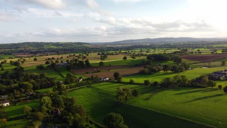Drone-shot-green-fields-and-nature-in-Shropshire-countryside,-England