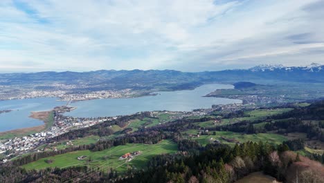 Far-aerial-view-of-lake-Zurich-and-bridge-connect-municipalities,-Switzerland